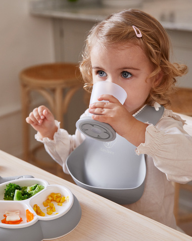 Bavoir r&eacute;cup&eacute;rateur Coloris gris  Babybj&ouml;rn